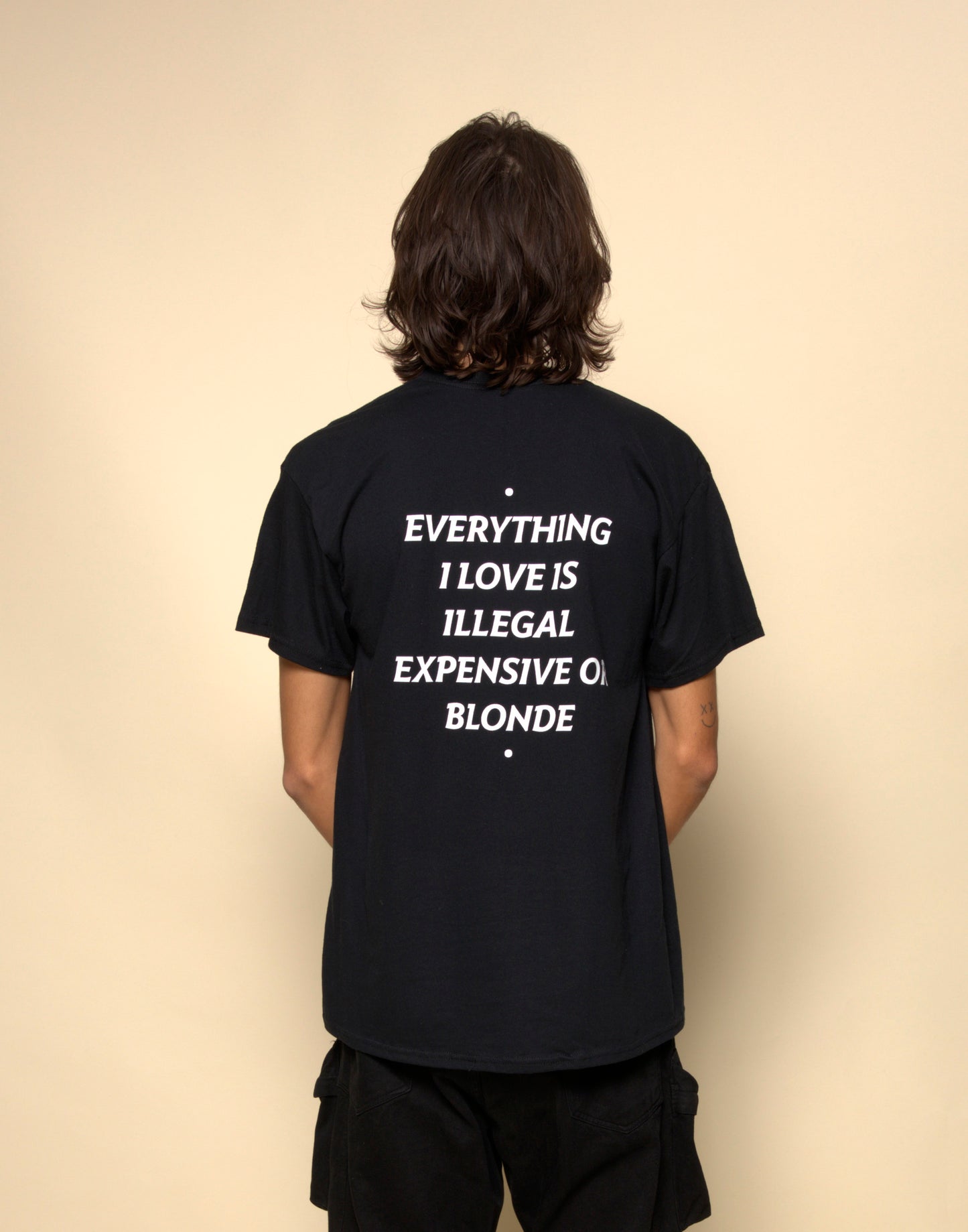 everything i love is illegal expensive or blonde t-shirt black. By FRASED. Unisex heavy cotton tee with a crew neckline and graphic screen print, made from 100% cotton, featuring a classic fit and tear-away label for comfort.