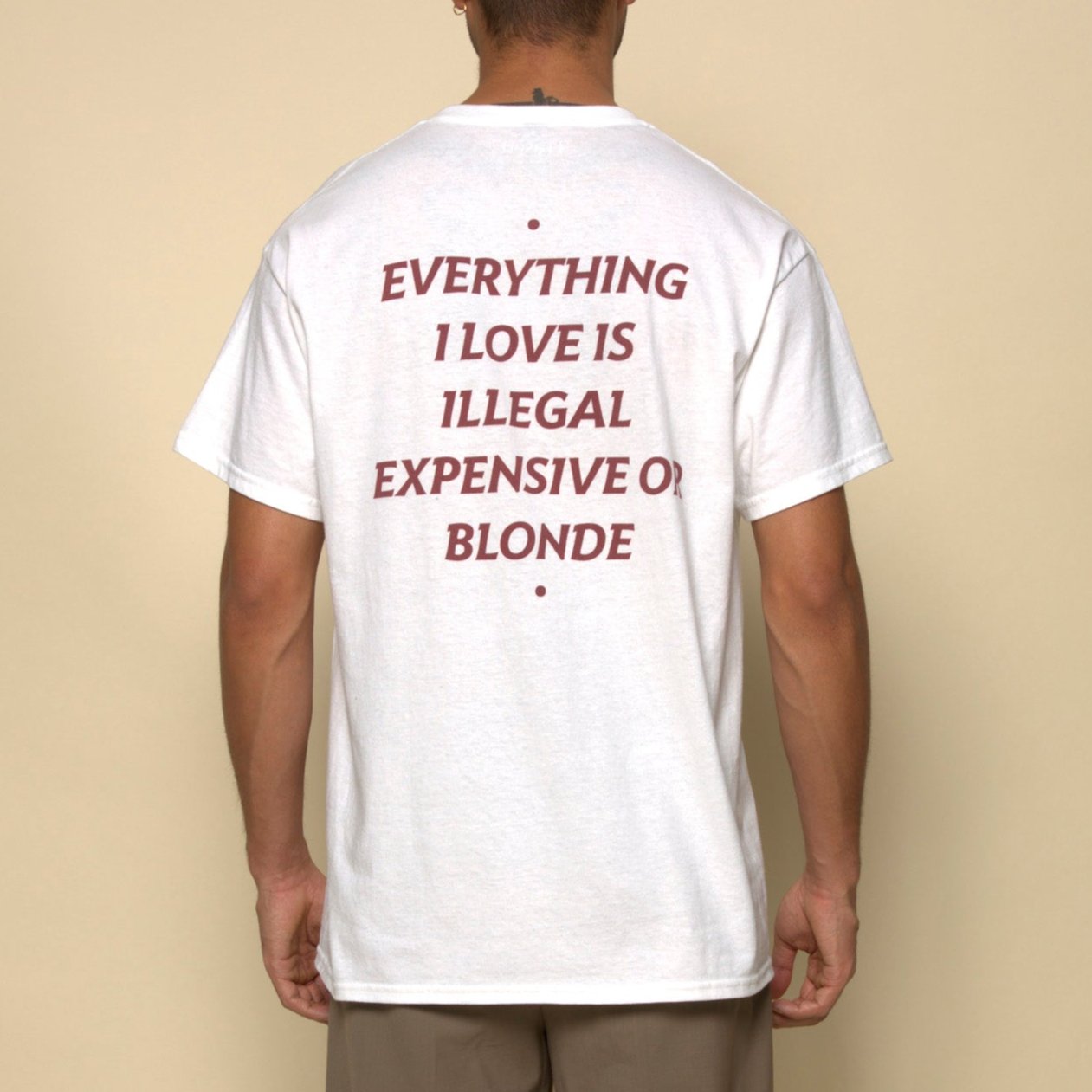 everything i love is illegal expensive or blonde t-shirt white. By FRASED. Unisex heavy cotton tee with a crew neckline and graphic screen print, made from 100% cotton, featuring a classic fit and tear-away label for comfort.