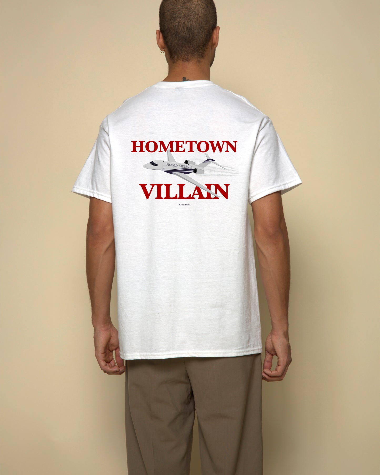 hometown villain t-shirt white. By FRASED. Unisex heavy cotton tee with a crew neckline and graphic screen print, made from 100% cotton, featuring a classic fit and tear-away label for comfort.