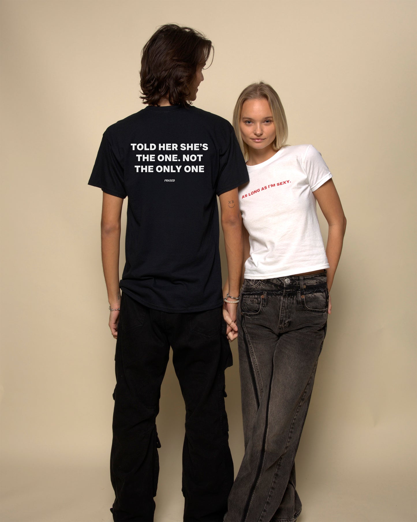 told her shes the one not the only one t-shirt black. By FRASED. Unisex heavy cotton tee with a crew neckline and graphic screen print, made from 100% cotton, featuring a classic fit and tear-away label for comfort.