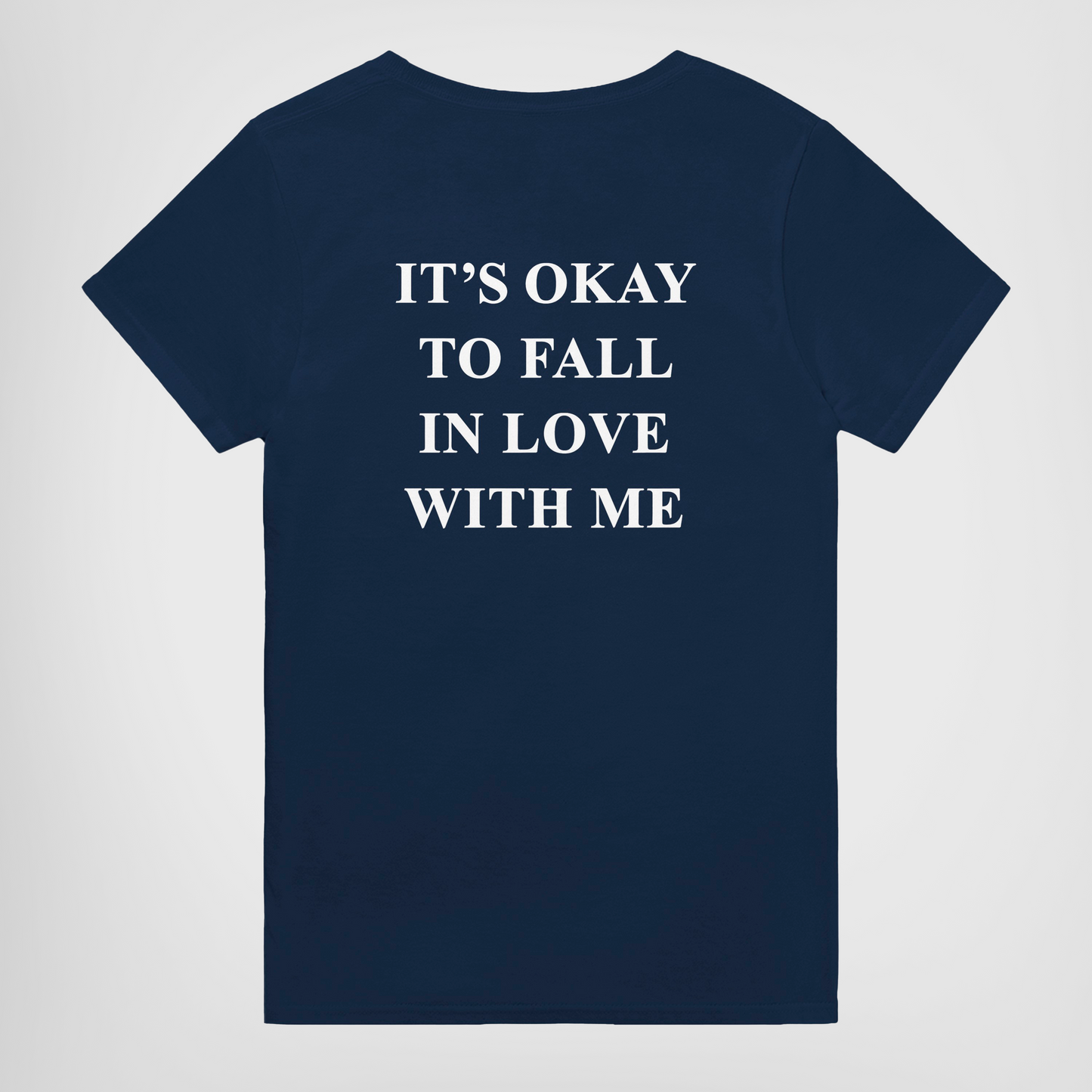 its okay to fall in love with me t-shirt navy. By FRASED. Unisex heavy cotton tee with a crew neckline and graphic screen print, made from 100% cotton, featuring a classic fit and tear-away label for comfort.