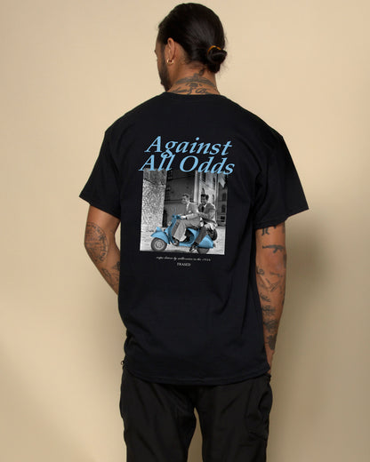 Against All Odds t-shirt black. Unisex heavy cotton tee with a crew neckline and graphic screen print, made from 100% cotton, featuring a classic fit and tear-away label for comfort.