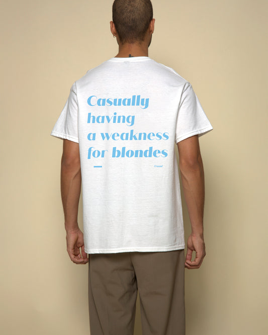 Casually having weakness for blondes t-shirt white. By FRASED. Unisex heavy cotton tee with a crew neckline and graphic screen print, made from 100% cotton, featuring a classic fit and tear-away label for comfort.