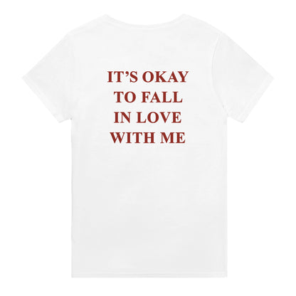 its okay to fall in love with me t-shirt white. By FRASED. Unisex heavy cotton tee with a crew neckline and graphic screen print, made from 100% cotton, featuring a classic fit and tear-away label for comfort.