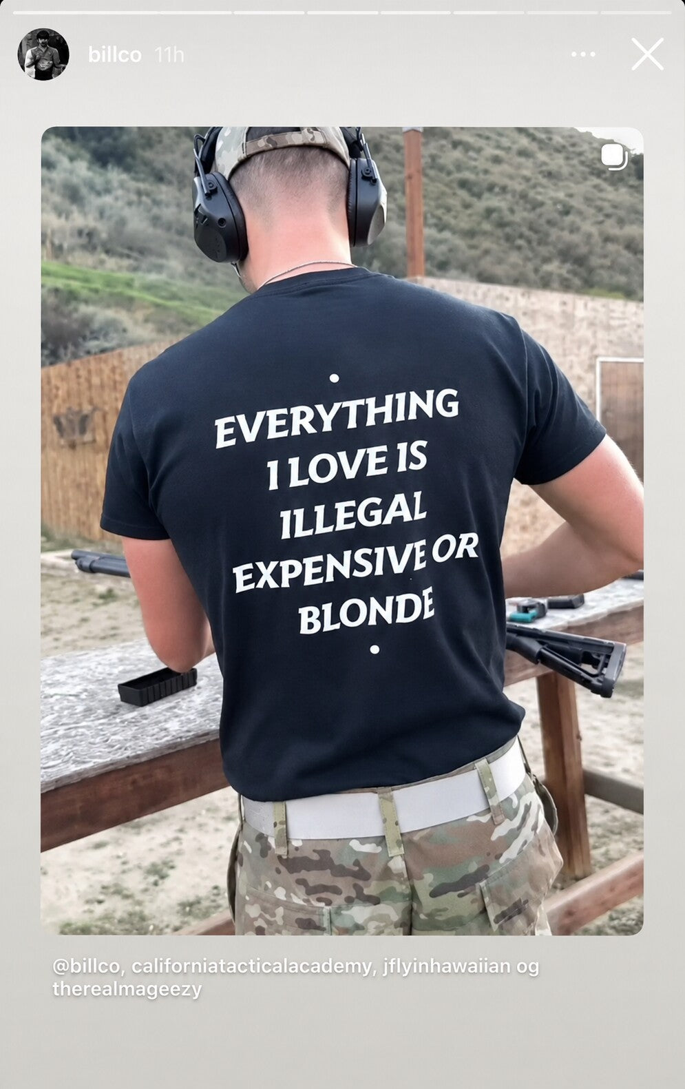 Person at an outdoor shooting range in a black “EVERYTHING I LOVE IS ILLEGAL EXPENSIVE OR BLONDE” T-shirt.